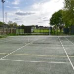 cleaning a tennis court