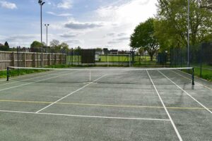 cleaning a tennis court